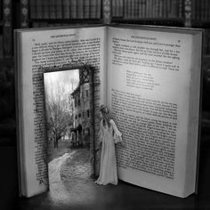 an open book on a table with a photo inside