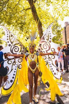 a woman in a yellow and white butterfly costume