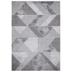 a gray and white rug with geometric shapes on the bottom, in different sizes and colors