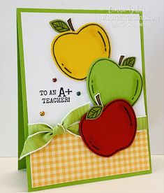 a close up of a card with an apple and two apples on it's side