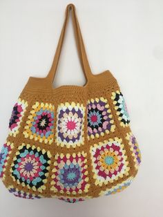 Mustard Color Crochet Granny Square Long Handle Shoulder Bag, Crochet Bag, Summer Bag, Crochet Totes, Granny Bag, Crochet Tote Bag Handmade This beautiful handmade bag 🌸 is perfect for completing your outfits. 55% Cotton - 45% Pac Light and handy Width: 45 cm - 17,3 inch Length: 33 cm - 12,9 inch Overall height with bag handle approximately : 55 cm - 21,6 inch There is one inner pocket. Dry cleaning recommended 🌸 Thank you so much 🌸 Beige Granny Square Shoulder Bag, Everyday Crochet Bag With Granny Square, Yellow Crochet Rectangular Shoulder Bag, Multicolor Crochet Bucket Bag, Yellow Crochet Rectangular Bag, Brown Crochet Bag With Granny Square Design, Brown Crochet Shoulder Beach Bag, Brown Rectangular Crochet Bag With Granny Square, Bohemian Granny Square Shopping Bag