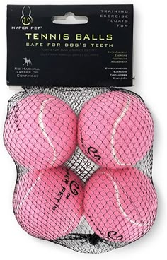 four pink tennis balls in a mesh bag