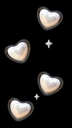 three hearts shaped like stars on a black background