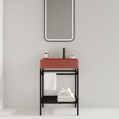 a bathroom with a sink, mirror and towel rack