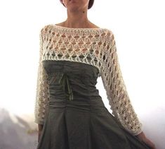 a woman wearing a dress with crochet on it