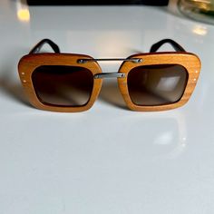 Walnut Wood Prada Sunglasses Wooden Glasses, Wood Sunglasses, Prada Accessories, Prada Sunglasses, Screen Wallpaper, Colored Sunglasses, Glasses Accessories, Lock Screen, Walnut Wood