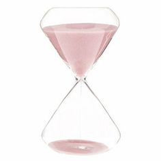 an hourglass with pink sand inside on a white background