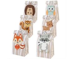 four bags with animals on them and one has an owl, raccoon, fox, bear, deer