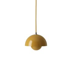 a yellow pendant light hanging from a ceiling