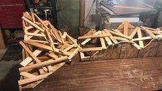 some wood pieces are laying on top of a workbench