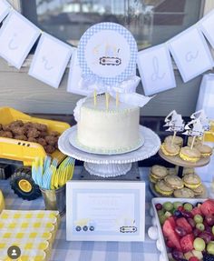 a table topped with lots of food and desserts