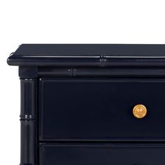 a black night stand with two drawers on one side and gold knobs on the other