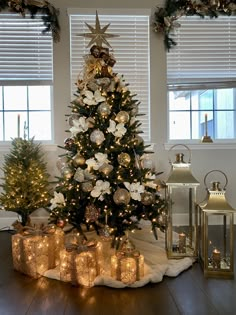 a decorated christmas tree with presents under it