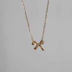 💎 Materials: 18k Gold Plated over Solid Sterling Silver Body - Hypoallergenic and Tarnish-Free 📐 Length: 40cm + 5cm extension Gold Ribbon Necklace, Ribbon Pendant Necklace, Gold Bow Jewelry, Bow Necklace Gold, Ribbon Necklace With Pendant, Gold Bow Necklace, Gold Dainty Jewelry, Ribbon Necklaces, Ribbon Aesthetic