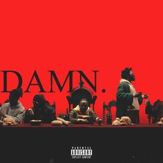 a group of people sitting at a table in front of a red wall with the word damn on it