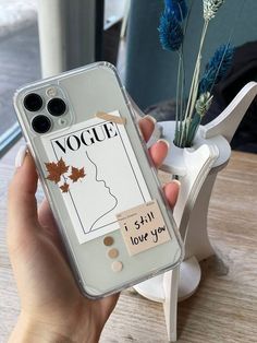 a person holding up a phone case with an image of a woman's face on it