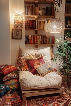 a living room filled with lots of furniture and bookshelves next to a potted plant