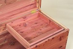 an open wooden box sitting on top of a table