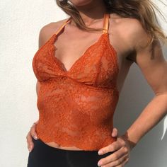 Beautiful Vivid burnt pumpkin orange autumnal copper toned Lace bralette Top Made with the most beautiful lightly chorded sheer orange lace 🌹 GORGEOUS handmade bralette design Sheer bodice with lined bra cups! Hand Made to order Halterneck straps Or ask for regular style bra straps 💗 Eco packaging ♻️ Made with love care and quality, by me 💗 Size guide XS / uk 6-8 / 28,30,32,AA,A,B, / Laid Flat 30cm S / uk 8-10 / 32,34,B,C / LF 32cm M / uk 12-14 / 36,C,D / LF 35cm L / uk 16 / 38,40,D,DD / LF 38cm Custom / all other or in between sizes not aligning with the chart - simply send me your size (bra size is most accurate) and I can sew your top to your bra size Love Rebecca @RobinLace please note all tops in my shop are custom handmade to order specifically for the customer so are non returnab Orange Spaghetti Strap Top, Orange Lace Top, Lace Bralette Top, Festival Crop Tops, Orange Crop Top, Eco Packaging, Orange Satin, Orange Tank Top, Tank Top Outfits