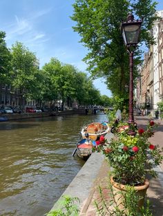 boats are parked along the side of a river