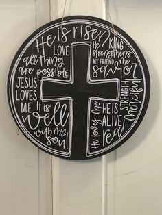 a black and white sign with the words he is risen written in different languages on it