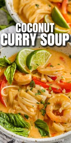 two bowls filled with coconut curry soup and garnished with limes