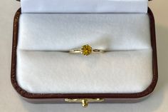 Lovely vintage 14K yellow gold ring featuring a beautiful yellow Sapphire . The gemstone is a bright yellow, round cut, and weighs an estimated .46 carats. The setting is lovely, 6 prong raised ring head. Stunning piece of fine Mid-Century era jewelry with September birthstone, circa 1960. ERA - Circa 1960s METAL / MATERIAL - 14k yellow gold, 1 Yellow Sapphire [estimated .46 carats] MARKINGS / HISTORY - 14k with a Crown CONDITION - Good vintage condition. Yellow sapphire is secure in setting and Heirloom Yellow Diamond Ring As Gift, Heirloom Yellow Diamond Ring Gift, Heirloom Style Yellow Diamond Ring Gift, 14k Gold Vvs Clarity Birthstone Ring, Yellow Gold Yellow Sapphire Promise Ring, Gold Yellow Sapphire Diamond Ring With Prong Setting, Yellow Diamond Ring With Vvs Clarity For Gift, Gold Diamond Ring With Prong Setting And Yellow Sapphire, Yellow Diamond Ring With Vvs Clarity As A Gift