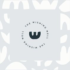 the wishing well logo is shown in black and white on a light gray background