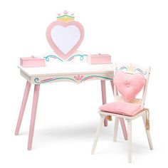 a toy desk and chair with a heart shaped box on it's back end