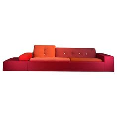 an orange and red couch sitting on top of a white floor