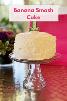 a white cake sitting on top of a glass plate