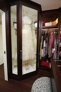 a wedding dress is displayed in a closet