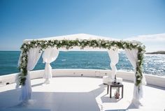 an outdoor wedding setup overlooking the ocean