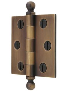 a close up of a door hinge with three holes on the front and side