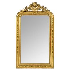 an ornate gold framed mirror against a white background