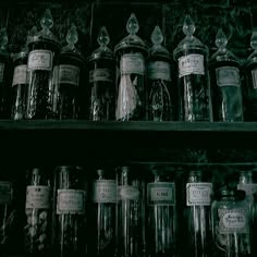 many jars are lined up on the shelves