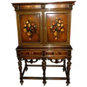 an ornate wooden cabinet with flowers painted on it