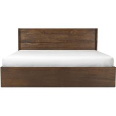 a wooden bed frame with white sheets and pillows