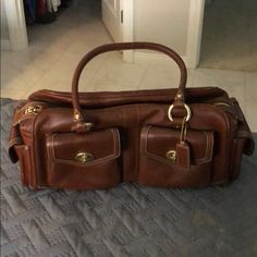 Beautiful Brown Vintage Coach Bag Probably Over 20 Years Old! I Had A Hard Time Parting With This Beauty But Want Someone To Love It As Much As Me! Two Front Pockets And Two Side Pockets . There Is Distress On The Bad Due To The Soft Leather. Beige Detail Stitching And Gold Hardware Make This Gorgeous! Inside Has The Original Satin Lining In Great Condition! 15.5 Wide By 5 Across And 5.5 Tall Coach Bags Vintage, Vintage Coach Purse, Coach Vintage Bag, Bag Shelf, Thrift List, Vintage Coach Bag, Vintage Coach Bags, Brown Handbag, Brown Vintage