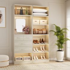 a room with white walls and wooden shelves filled with shoes, purses and other items