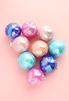 colorful marbled easter eggs on a pink background with the words god splatter ornaments