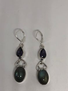 Delicate and detailed green Labradorite and amethyst stone Silver leverback earrings These dangle earrings are about 2 inch long All jewelry is shipped in a nice gift box. Check out our over a THOUSAND great reviews Silver Earrings Vintage, Green Labradorite, Pewter Earrings, Long Earring, Silver Dangle Earrings, Jewelry Lookbook, Leverback Earrings