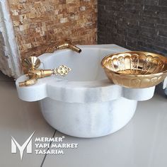 a bathroom with a sink, faucet and soap dispenser in it