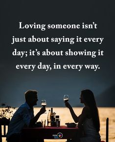 a man and woman sitting at a table with wine glasses in front of them, saying loving someone isn't just about saying it every day