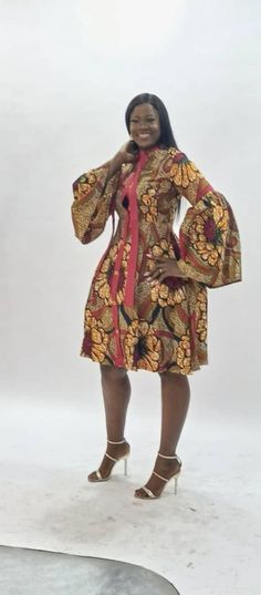 African Print ankara shirt dress, robe africaine below the knee Africa dress, with neck tie and long pleated sleeves Sewa dress is comfortable to wear and provides an elegant look for any special occasion. A fit and flare A line tie neck shirtdress with contrast neck tie and flared sleeves. The shirtdress is closed with button detail running down the length of the dress. Rock the tie neck trend with the long tie sitting on the mandarin shirt collar. The skirt part of this dress is lined, the Ank African Dresses Plus Size, Ankara Shirt Dress, Ankara Shift Dress, African Shirt Dress, Dress With Neck Tie, Ankara Shirt, African Print Shirt, African Print Tops, Africa Dress