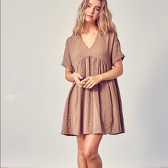 Mauve/Tan Textured Dress With Beautiful Detailing Summer Khaki Mini Dresses, Khaki Mini Summer Dresses, Khaki Mini Length Summer Dress, Khaki Mini Dress For Summer, Brown V-neck Mini Dress For Spring, Summer Neutral Short Sleeve Dresses, Neutral Mini Dress For Daywear, Beige Short Sleeve Mini Dress For Fall, Brown Short Sleeve Midi Dress For Daywear