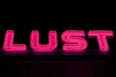 the word lust is lit up in red