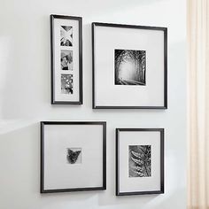 four black and white pictures hanging on the wall