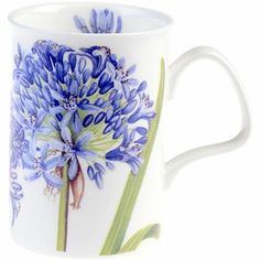 a coffee cup with blue flowers painted on it