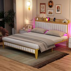 a large bed sitting on top of a wooden floor